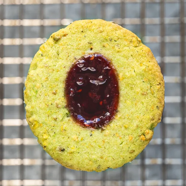 Raspberry Pistachio Thumbprint Cookies close up