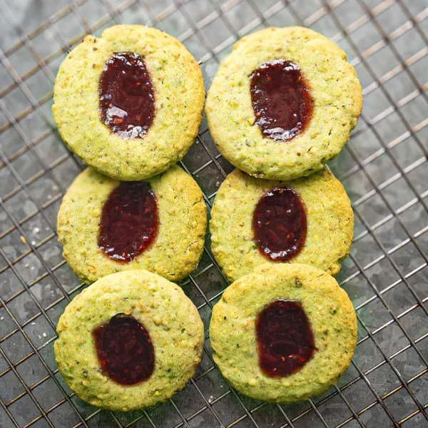 Stack of Raspberry Pistachio Thumbprint Cookies